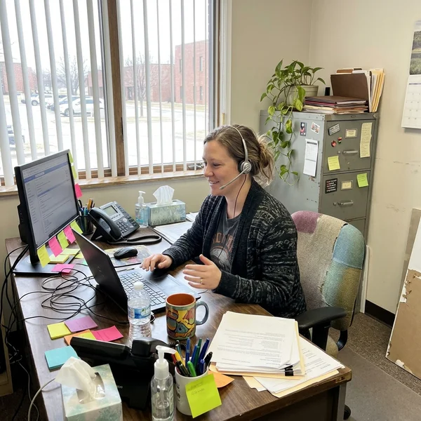 Customer support coordinator on the phone