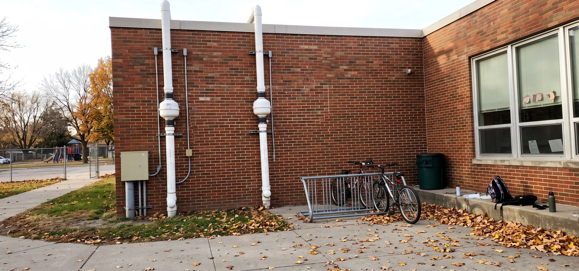 Commercial radon mitigation system on the exterior of an Iowa school building